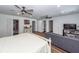 Large main bedroom with hardwood floors, sitting area, television, and closet space at 8562 N Highway 17, McClellanville, SC 29458