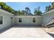 Enclosed patio with concrete floor and a comfortable hammock to enjoy the outdoors at 8562 N Highway 17, McClellanville, SC 29458