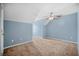 Spacious bedroom featuring neutral carpet, ceiling fan and freshly painted walls at 8743 Grassy Oak Trl, North Charleston, SC 29420