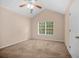 Bright bedroom with a ceiling fan and a window overlooking a serene outdoor view at 8743 Grassy Oak Trl, North Charleston, SC 29420