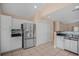 Modern kitchen with stainless steel appliances, white cabinetry, and a stylish backsplash at 8743 Grassy Oak Trl, North Charleston, SC 29420