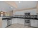 Well-lit kitchen featuring stainless steel appliances, granite countertops, and stylish backsplash at 8743 Grassy Oak Trl, North Charleston, SC 29420
