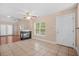 Open-concept living area with a fireplace and tile floors, ideal for modern living at 8743 Grassy Oak Trl, North Charleston, SC 29420