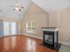 Spacious living room with a vaulted ceiling, fireplace, and sliding glass doors at 8743 Grassy Oak Trl, North Charleston, SC 29420