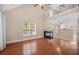 Bright living room featuring a fireplace and hardwood floors, providing a warm, inviting space at 8743 Grassy Oak Trl, North Charleston, SC 29420