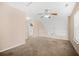 Loft area with neutral carpet, stairs, and natural light from the window at 8743 Grassy Oak Trl, North Charleston, SC 29420