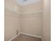 A walk-in closet with white wire racks for storage at 8743 Grassy Oak Trl, North Charleston, SC 29420