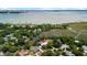 Beautiful aerial view of a charming home nestled among lush trees, near the water, with a pool at 910 Kushiwah Creek Ct, Charleston, SC 29412