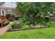 Lush backyard featuring a garden bed full of greenery and a well-maintained lawn at 910 Kushiwah Creek Ct, Charleston, SC 29412