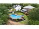 Inviting backyard oasis with a sparkling pool, lounge chairs, and well-maintained landscaping at 910 Kushiwah Creek Ct, Charleston, SC 29412
