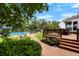 Inviting backyard oasis with a sparkling pool, deck, lounge chairs and lush greenery at 910 Kushiwah Creek Ct, Charleston, SC 29412