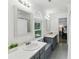 Bright, spacious bathroom featuring a double vanity, window seat, and modern fixtures at 910 Kushiwah Creek Ct, Charleston, SC 29412