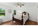 A well-lit bedroom showcases natural light, hardwood floors, and a calming decor at 910 Kushiwah Creek Ct, Charleston, SC 29412