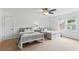 Spacious bedroom featuring twin beds, soft carpet, and large window views at 910 Kushiwah Creek Ct, Charleston, SC 29412