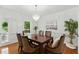 Elegant dining room with a chandelier, dining table with seating for six, and modern decor at 910 Kushiwah Creek Ct, Charleston, SC 29412