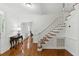 Elegant foyer featuring hardwood floors, a staircase, and a view into other living spaces at 910 Kushiwah Creek Ct, Charleston, SC 29412
