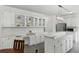 Well-lit kitchen with custom cabinets, stylish countertops, and a built-in desk area at 910 Kushiwah Creek Ct, Charleston, SC 29412