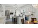 Bright kitchen with stainless steel appliances, breakfast bar, and a separate dining area at 910 Kushiwah Creek Ct, Charleston, SC 29412