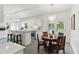 Charming kitchen with white cabinets, quartz countertops, and a cozy breakfast nook at 910 Kushiwah Creek Ct, Charleston, SC 29412