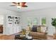 Relaxing living room with built-in shelving, comfortable sofa, and outdoor views at 910 Kushiwah Creek Ct, Charleston, SC 29412