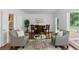 Comfortable living room with armchairs, hardwood floors, and natural light at 910 Kushiwah Creek Ct, Charleston, SC 29412