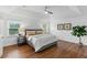 Bright main bedroom with tray ceiling, hardwood floors, neutral tones, and great natural light at 910 Kushiwah Creek Ct, Charleston, SC 29412