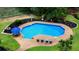 Aerial view of a sparkling in-ground pool with lounge chairs in the landscaped backyard of this property at 910 Kushiwah Creek Ct, Charleston, SC 29412