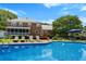 Lovely in-ground pool with patio furniture and a spacious deck for outdoor entertaining and relaxation at 910 Kushiwah Creek Ct, Charleston, SC 29412