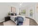 Well-lit bedroom with hardwood floors, a comfortable bed, and a door to a balcony area at 1012 Basildon Rd, Mount Pleasant, SC 29466