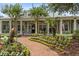 A welcoming brick path leads to the clubhouse, enhanced by colorful flowerbeds and mature trees at 1012 Basildon Rd, Mount Pleasant, SC 29466