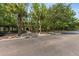Scenic community entrance with lush landscaping, mature trees, and inviting stone pathway and an open courtyard at 1012 Basildon Rd, Mount Pleasant, SC 29466