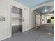 Hallway with elevator access and stairs leads to the apartments at 1012 Basildon Rd, Mount Pleasant, SC 29466