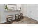 Kitchen with breakfast bar and stools, adjacent to open living space at 1012 Basildon Rd, Mount Pleasant, SC 29466