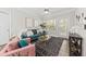 Bright living room features modern decor, plush seating, and ample natural light at 1012 Basildon Rd, Mount Pleasant, SC 29466