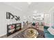 Bright living room with modern decor, stylish furniture, and an open floor plan to the kitchen area at 1012 Basildon Rd, Mount Pleasant, SC 29466