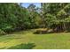 Serene community pond surrounded by lush greenery, offering a peaceful retreat for residents to enjoy nature at 1012 Basildon Rd, Mount Pleasant, SC 29466