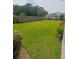 Expansive, well-maintained backyard with lush green grass and a wood fence, ideal for outdoor activities and relaxation at 103 Savannah River Dr, Summerville, SC 29485