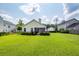 Well-kept lawn with manicured shrubs and a cozy screened-in porch perfect for relaxing at 103 Savannah River Dr, Summerville, SC 29485