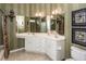 Elegant bathroom with double sinks, vanity, decorative mirrors, and a toilet at 103 Savannah River Dr, Summerville, SC 29485