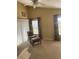 Bright bedroom with vaulted ceiling and natural light, complete with curtains and a comfy chair with an ottoman at 103 Savannah River Dr, Summerville, SC 29485