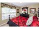 Inviting bedroom with patterned bedding, floral valance, and stylish decor at 103 Savannah River Dr, Summerville, SC 29485