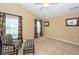 Bright bedroom with large windows, plaid chairs, and neutral paint at 103 Savannah River Dr, Summerville, SC 29485