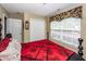 Charming bedroom with red and black bedding and double door closet at 103 Savannah River Dr, Summerville, SC 29485