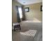 Inviting bedroom bathed in natural light featuring neutral walls, plush carpet, and a decorative stool near the window at 103 Savannah River Dr, Summerville, SC 29485