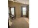 Spacious bedroom featuring a vaulted ceiling, ample natural light, and a cozy chair with ottoman, creating a serene retreat at 103 Savannah River Dr, Summerville, SC 29485