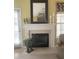 Close-up of a fireplace with a white mantel, decorative accents, and a cozy ambiance at 103 Savannah River Dr, Summerville, SC 29485