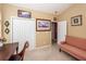 Cozy home office with closet, nautical art, and a red and white striped loveseat at 103 Savannah River Dr, Summerville, SC 29485