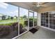 Inviting screened porch with scenic backyard view and ceiling fan at 103 Savannah River Dr, Summerville, SC 29485