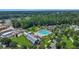 Aerial view of a community pool and clubhouse surrounded by lush landscaping and convenient parking at 109 Medford St, Summerville, SC 29486