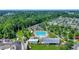 Aerial view of a community pool and clubhouse surrounded by lush landscaping and convenient parking at 109 Medford St, Summerville, SC 29486